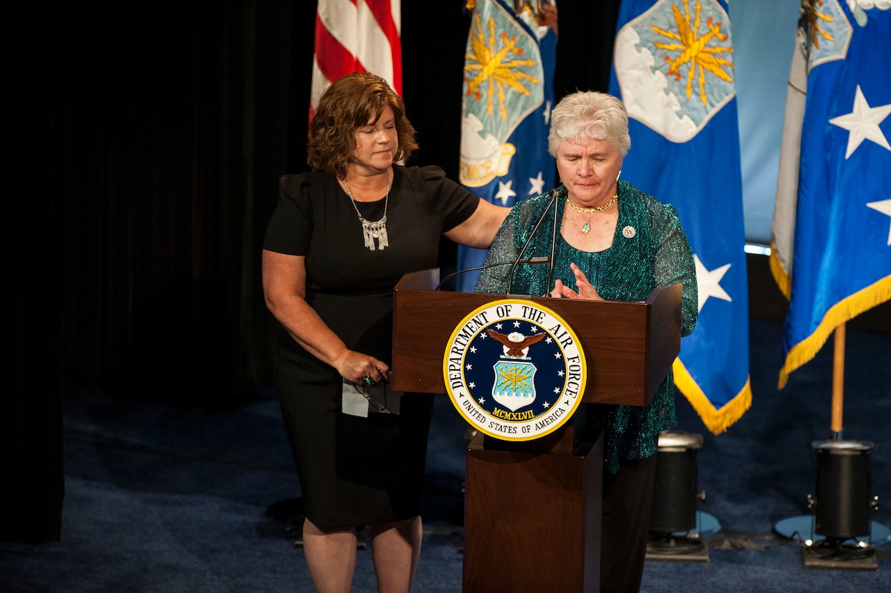 Terry Chapman, mother of Tech. Sgt. John Chapman, gives remarks about her son while her daughter, Lori Longfritz, comforts her during Chapman’s Hall of Heroes induction ceremony at the Pentagon, in Arlington, Va., Aug. 23, 2018. Chapman was posthumously awarded the Medal of Honor for actions on Takur Ghar Mountain in Afghanistan March 4, 2002. An elite special operations team was ambushed by the enemy and came under heavy fire from multiple directions. Chapman immediately charged an enemy bunker through thigh-deep snow and killed all enemy occupants. Courageously moving from cover to assault a second machine gun bunker, he was injured by enemy fire. Despite severe wounds, he fought relentlessly, sustaining a violent engagement with multiple enemy personnel before making the ultimate sacrifice. With his last actions he saved the lives of his teammates. (U.S. Air Force photo by Staff Sgt. Rusty Frank)