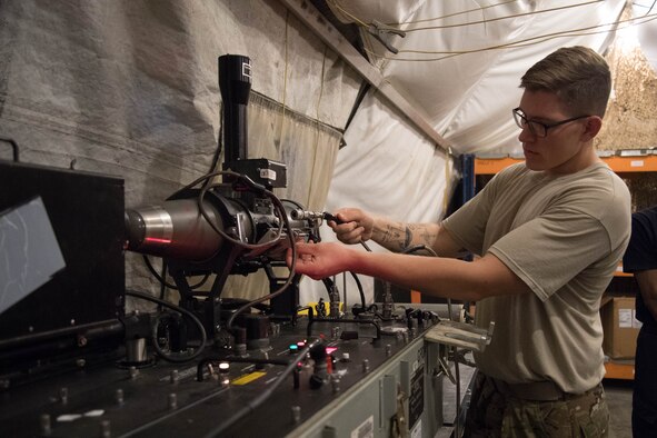 Staff Sgt. Braedon Driscoll, 380th Maintenance Squadron munitions flight, prepares a missile for testing on Al Dhafra Air Base, Aug. 13, 2018. The 380th MXS munitions flight worked with the ADAB host nation partner to test 24 missiles. (Photo by Staff Sgt. Erica Rodriguez)