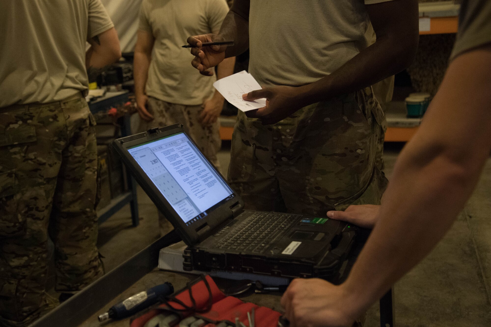 Members from the 380th Maintenance Squadron munitions flight work together to test missiles on Al Dhafra Air Base, Aug. 13, 2018. The 380th MXS munitions flight worked with the ADAB host nation partner to test 24 missiles which provided training and fostered partnership between the two nation’s offices. (Photo by Staff Sgt. Erica Rodriguez)
