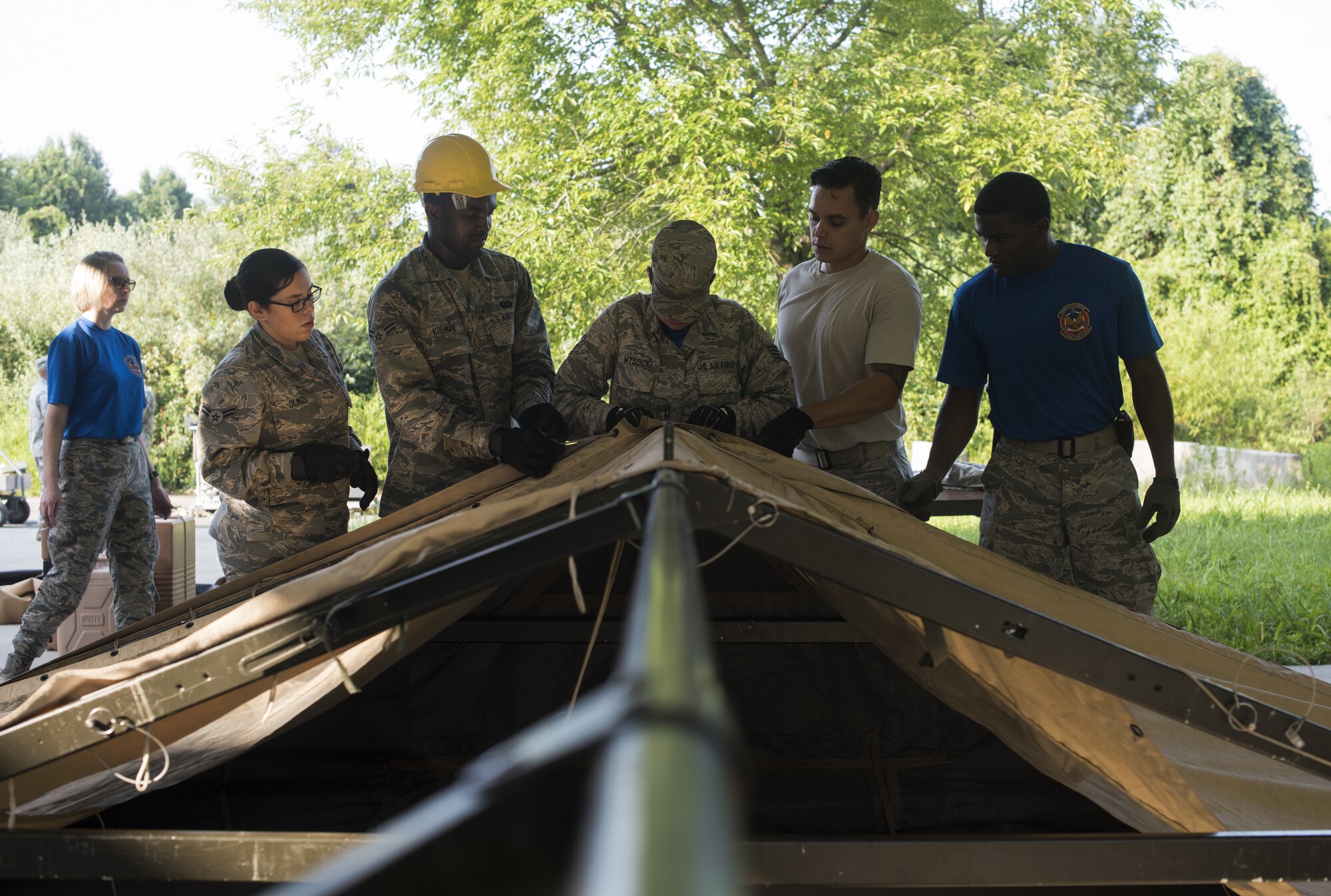 Airmen with the 87th Force Support Squadron setup a Single Pallet Expeditionary Kitchen during a home station readiness training on Joint Base McGuire-Dix-Lakehurst, N.J., Aug. 17, 2018. The SPEK is a mobile kitchen that can be setup within two hours by eight people, powered by a two kilowatt generator and used in a deployed, underdeveloped environment.
