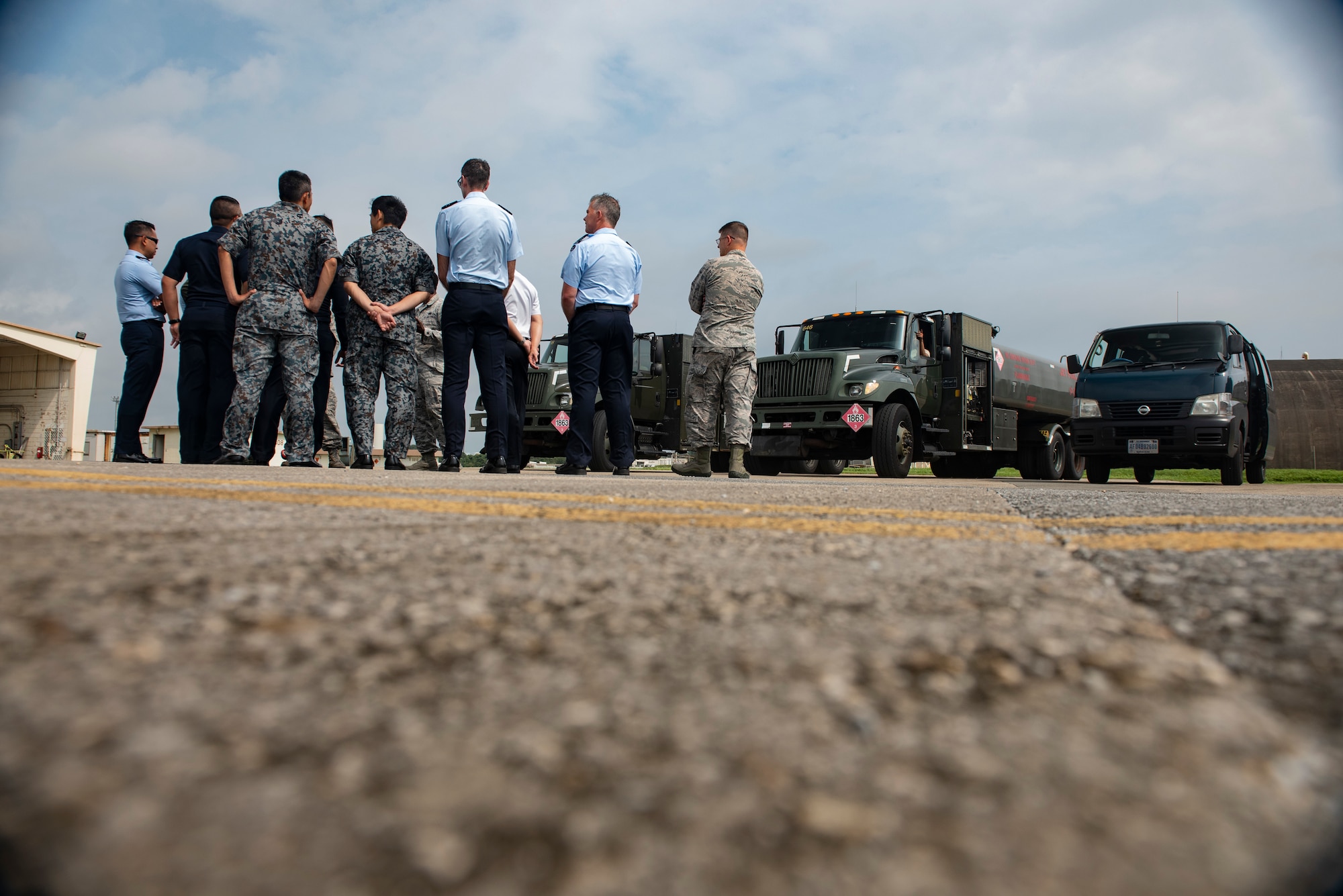 Officers of allied and partner nations are briefed about aircraft fueling operations during the 2018 Fighter Logistics and Safety Symposium Aug. 21, 2018, at Kadena Air Base, Japan. The symposium enabled air force officers from Australia, Indonesia, Japan, the Philippines, Singapore and Thailand to visit fighter support units assigned to the 18th Wing and interact with Airmen who support the fighter mission. (U.S. Air Force photo by Staff Sgt. Micaiah Anthony)
