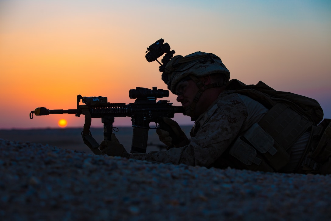 A U.S. Navy Corpsman with India Company 3rd Battalion, 7th Marine Regiment, 1st Marine Division attached to Special Purpose Marine Air-Ground Task Force, Crisis Response-Central Command provide security during a tactical recovery of aircraft and personnel  exercise August 19, 2018. The training exercise provided Marines the opportunity to enhance combat readiness and crisis response skills.