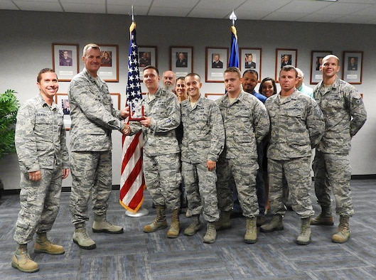 Here Colonel John Tryon AFCEC Operations Director, presents the APE Team the Joe Sciabica Teamwork Award for April to June 2018. It was also announced that the APE Team has received the General Mark Welsch III One Air Force Award for the entire Air Force.