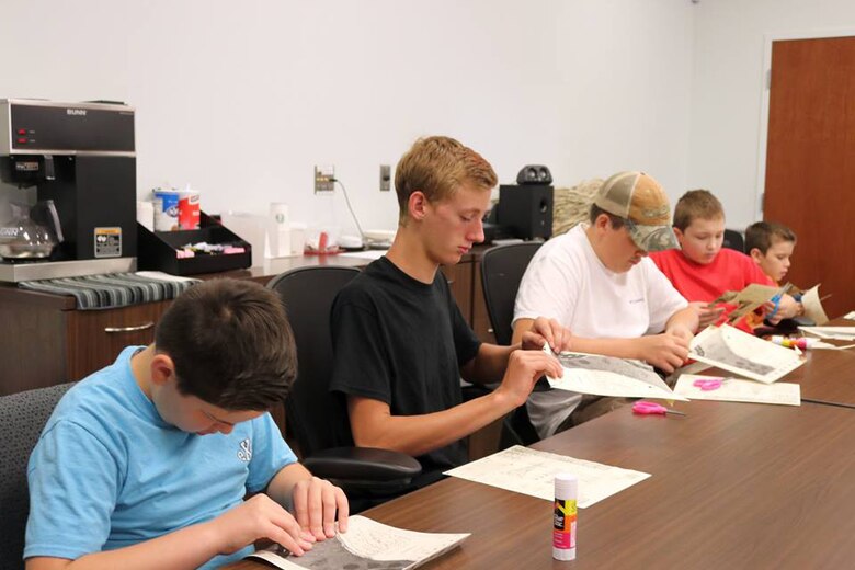 Four potential future engineers work to “build” their first hydropower plant July 26, 2018 at Cordell Hull Lake in Carthage, Tenn. (USACE Photo by Ashley Webster)