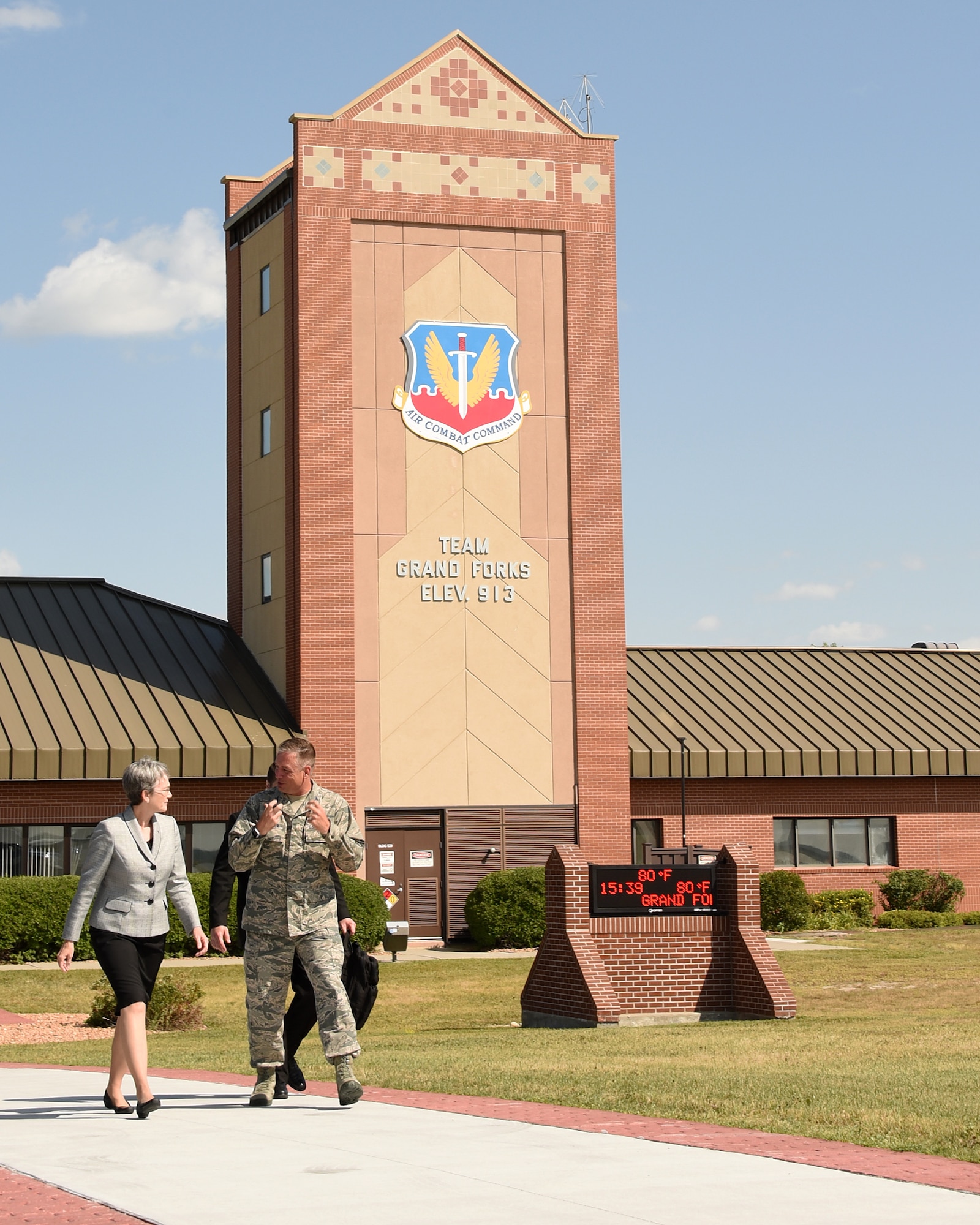 Secretary of the Air Force Heather Wilson walks with Col. Benjamin Spencer, 319th Air Base Wing commander, towards the flightline in order to board her departure flight August 21, 2018, from Grand Forks Air Force Base, North Dakota. Wilson arrived to Grand Forks AFB August 20, and spent her first day in North Dakota on base, meeting Airmen from multiple squadrons, and her second day in the local town learning about aerospace operations and education. (U.S. Air Force photo by Airman 1st Class Elora J. Martinez)