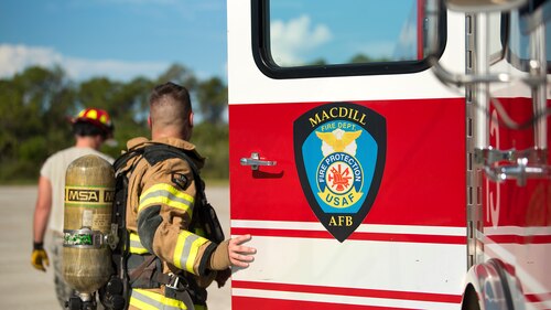A U.S. Air Force firefighter assigned to the 6th Civil Engineer Squadron, closes the door of a fire truck after a training session at MacDill Air Force Base, Fla., Aug. 21, 2018. The MacDill Fire and Emergency Services flight was recently awarded international reaccreditation status for their continuous quality improvement and enhancement of service delivery to the community.