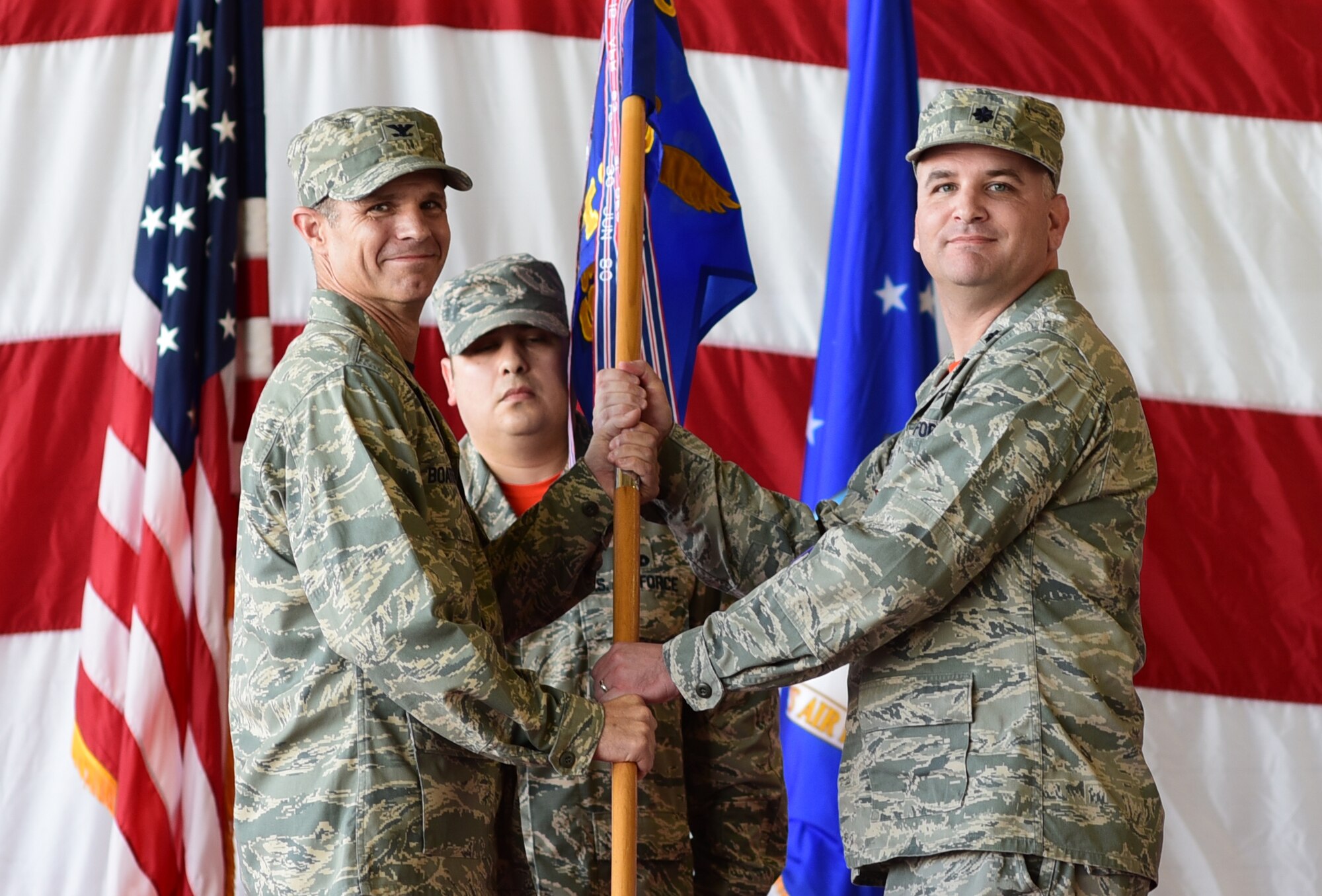 Col. Steven Boatright collects the ceremonial guidon from Lt. Col. Andrew Wistrcill.