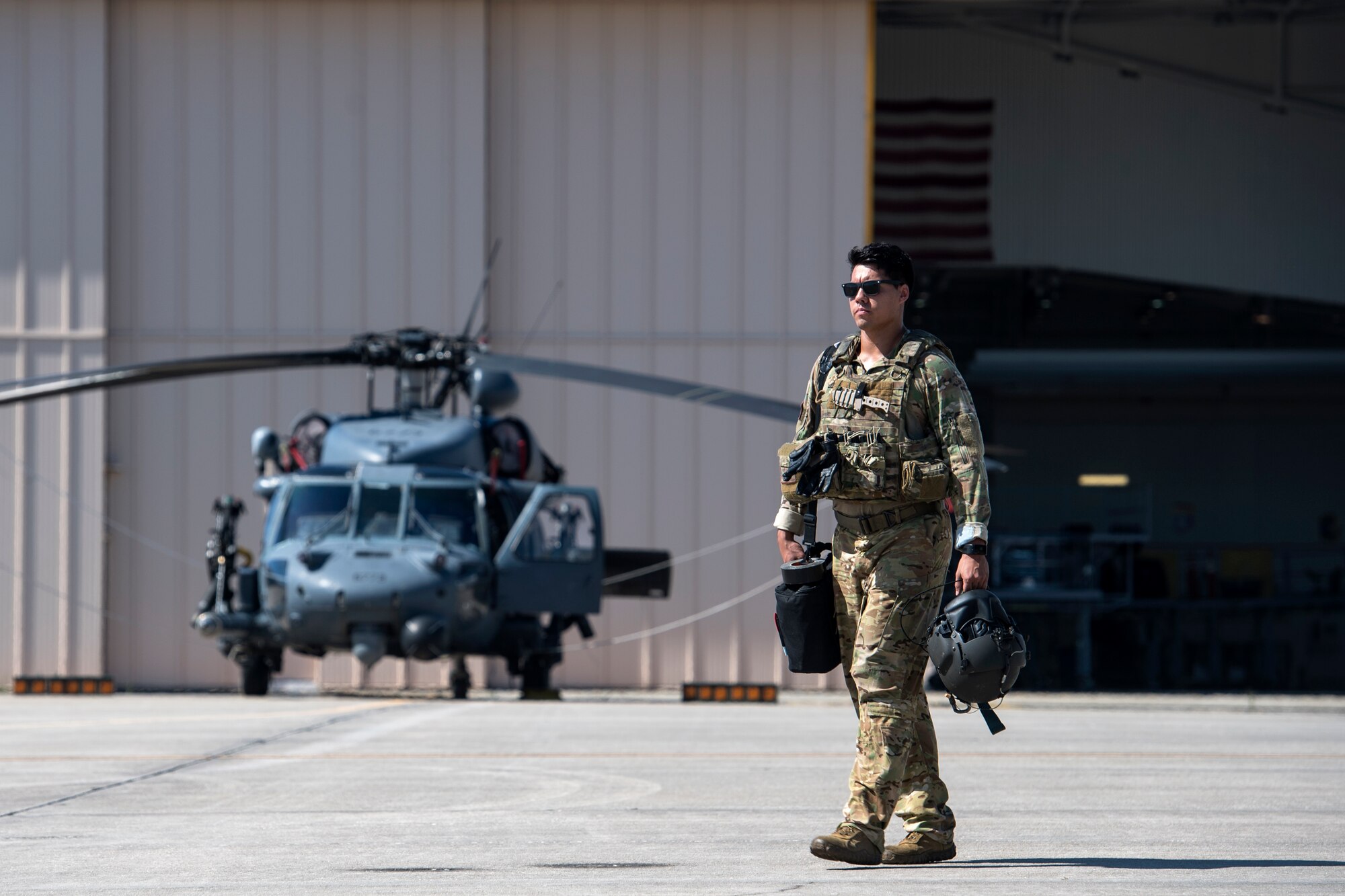 A special missions aviator from the 41st Rescue Squadron (RQS) prepares to board an HH-60G Pave Hawk, Aug. 17, 2018, at Patrick Air Force Base (AFB), Fla. Airmen from the 41st RQS and 41st Helicopter Maintenance Unit traveled to Patrick AFB to participate in a spin-up exercise. During the exercise, Airmen faced scenarios and situations they may encounter downrange. (U.S. Air Force photo by Senior Airman Janiqua P. Robinson)