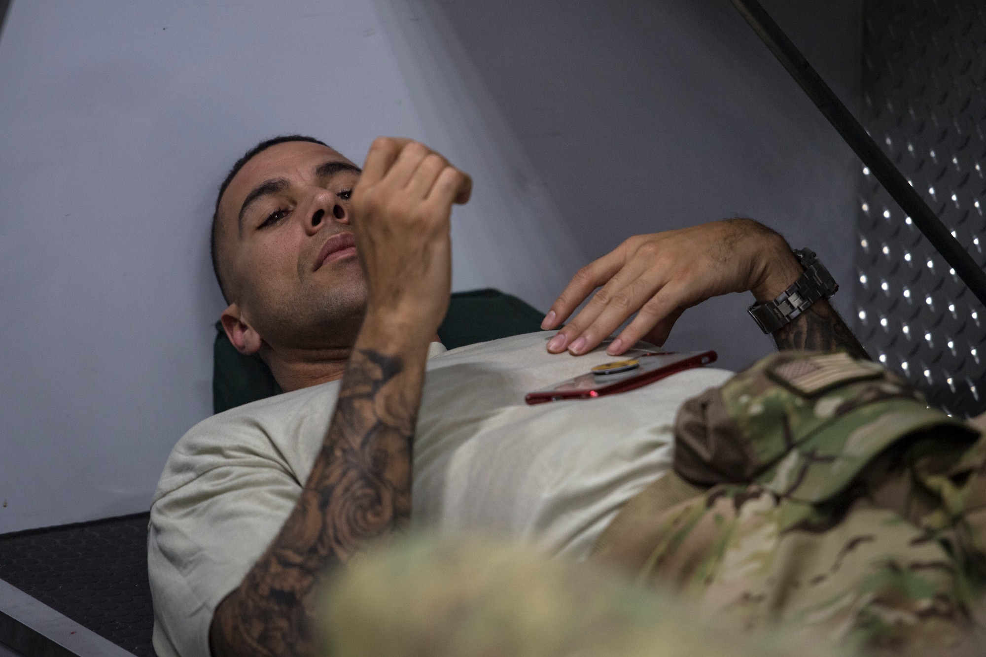 Senior Master Sgt. Andrew Griggs, 41st Rescue Squadron (RQS) superintendent, takes a break before a mission, Aug. 17, 2018, at Patrick Air Force Base, Fla. Airmen from the 41st RQS and 41st Helicopter Maintenance Unit traveled to Patrick AFB to participate in a spin-up exercise. During the exercise, Airmen faced scenarios and situations they may encounter downrange. (U.S. Air Force photo by Senior Airman Janiqua P. Robinson)