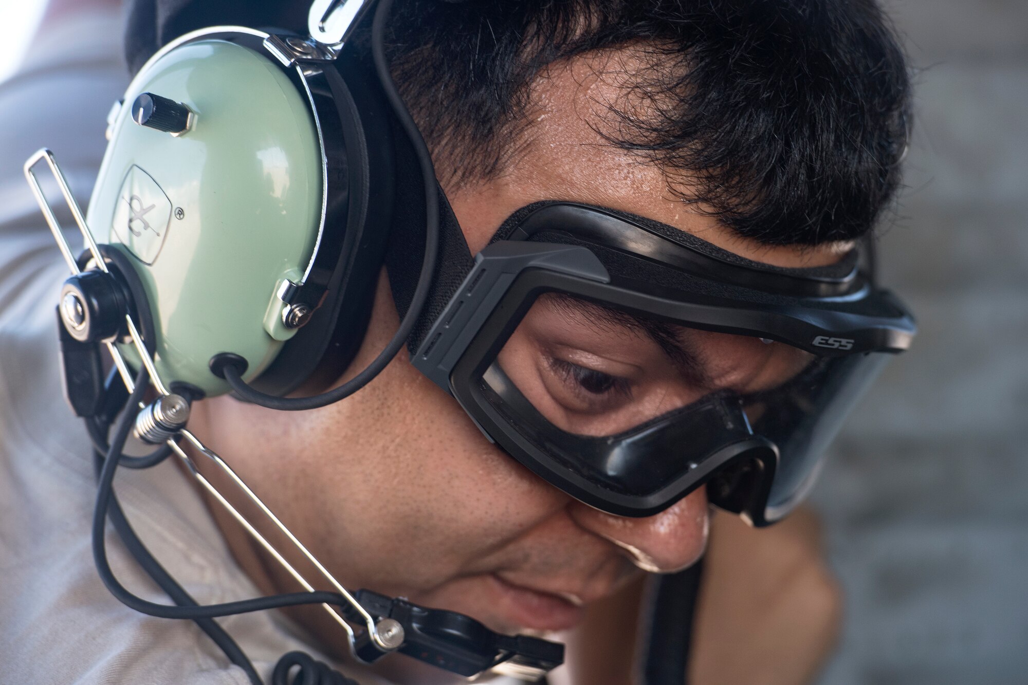 Senior Airman Jeremy David, 41st Helicopter Maintenance Unit (HMU) crew chief, performs the final checks before launching an HH-60G Pave Hawk, Aug. 17, 2018, at Patrick Air Force Base, Fla. Airmen from the 41st Rescue Squadron and 41st HMU traveled to Patrick AFB to participate in a spin-up exercise. During the exercise, Airmen faced scenarios and situations they may encounter downrange. (U.S. Air Force photo by Senior Airman Janiqua P. Robinson)