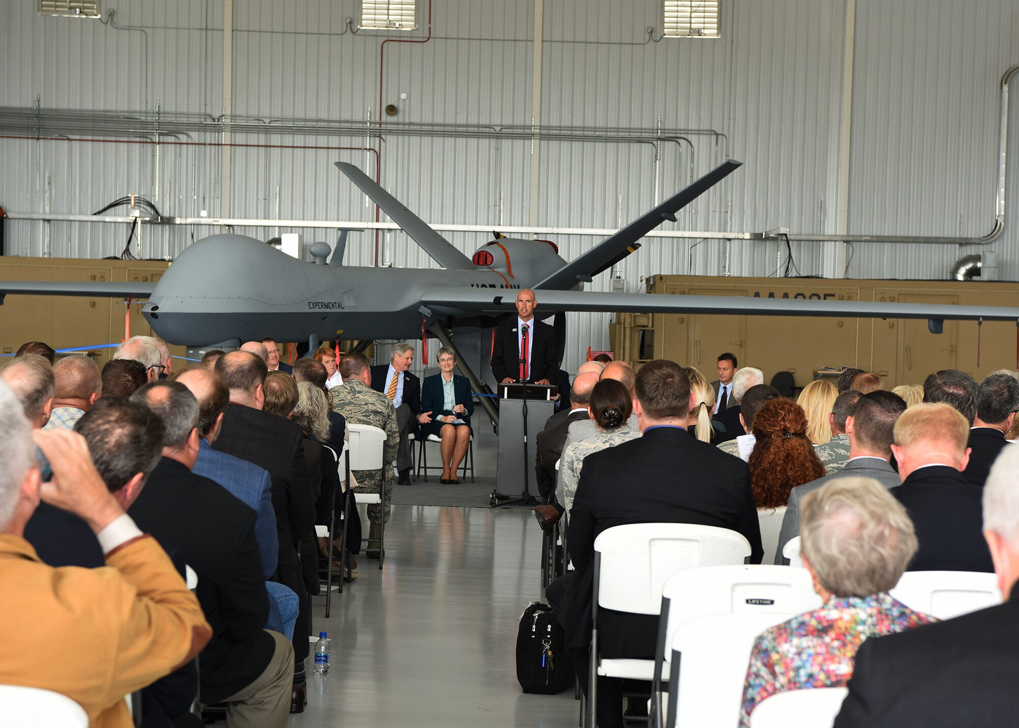 Nicholas Flom, Executive Director, Northern Plains Unmanned Aircraft System Test Site, gives a speech during the first civil beyond visual line of sight event August 20, 2018, at the Grand Sky Air Park at Grand Forks Air Force Base, North Dakota. The Federal Aviation Administration approved the Northern Plains UAS Test Site in Grand Forks to fly large unmanned aircraft systems beyond the visual line of sight Aug, 13, 2018, which marked a major milestone in the test sites history. (U.S. Air Force photo by Senior Airman Cierra Presentado)