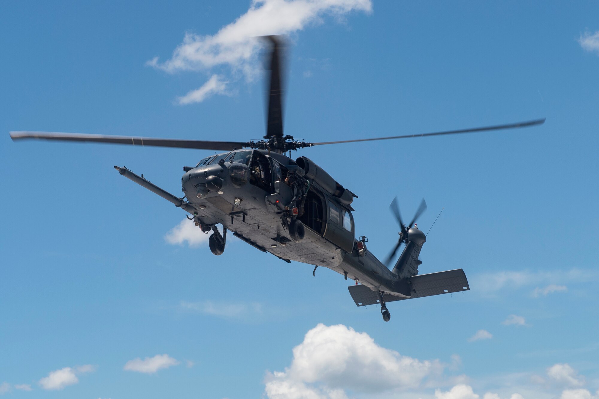 An HH-60G Pave Hawk hovers, Aug. 17, 2018, at Avon Park Air Force Range, Fla. Airmen from the 41st Rescue Squadron and 41st Helicopter Maintenance Unit traveled to Patrick AFB to participate in a spin-up exercise. During the exercise, Airmen faced scenarios and situations they may encounter downrange. (U.S. Air Force photo by Senior Airman Janiqua P. Robinson)