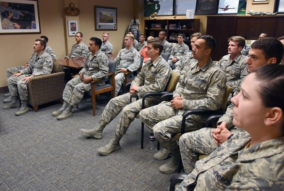 Airmen in the 334th Training Squadron watch a televised Medal of Honor presentation at Cody Hall at Keesler Air Force Base, Mississippi, Aug. 23, 2018. Tech. Sgt. John Chapman was posthumously awarded the Medal of Honor, the nation�s highest award for valor in combat, by U.S. President Donald Trump. Chapman was killed in Afghanistan on March 4, 2002. He attended the air traffic control course at Keesler in 1989. (U.S. Air Force photo by Kemberly Groue)
