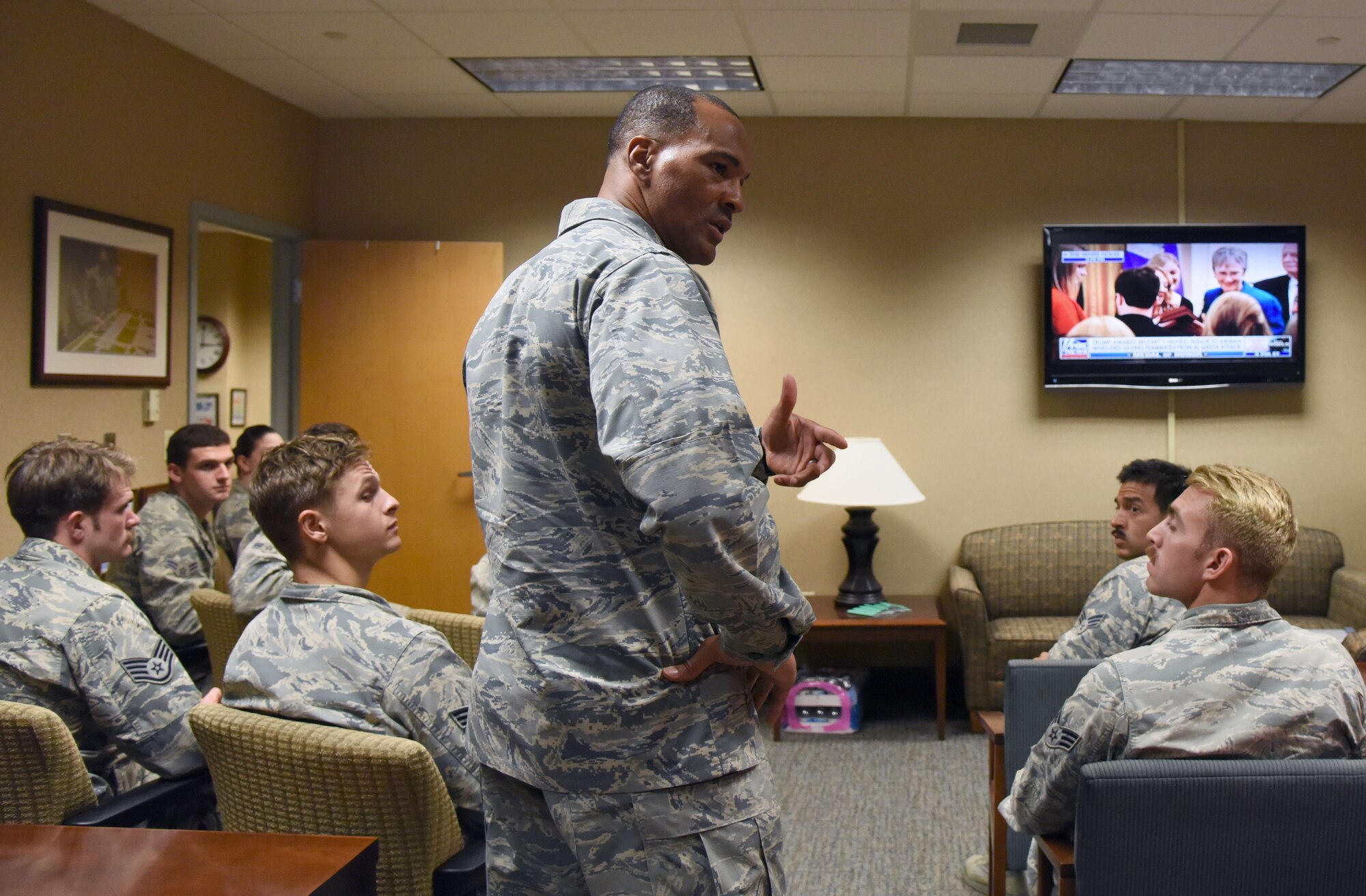 U.S. Air Force Lt. Col. Billy Wilson, 334th Training Squadron commander, speaks with Airmen after watching a televised Medal of Honor presentation at Cody Hall at Keesler Air Force Base, Mississippi, Aug. 23, 2018. Tech. Sgt. John Chapman was posthumously awarded the Medal of Honor, the nation�s highest award for valor in combat, by U.S. President Donald Trump. Chapman was killed in Afghanistan on March 4, 2002. He attended the air traffic control course at Keesler in 1989. (U.S. Air Force photo by Kemberly Groue)
