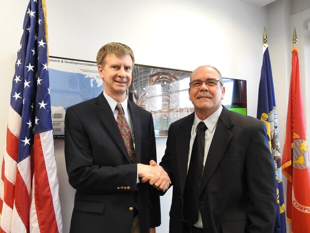 Naval Surface Warfare Center Panama City Division (NSWC PCD) Electrical Engineer, Jose E. Fernandez, shakes hands with Dr. Kerry Commander, Science and Technology Department Head at NSWC PCD. Mr. Fernandez has been selected by Great Minds in STEM™ (GMiS) for a Science, Technology, Engineering, and Mathematics (STEM) Hero Award.