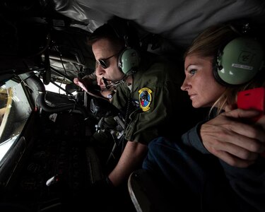 Air Force Master Sgt. Thomas Nance, a boom operator with the Washington Air National Guard's 141st Air Refueling Wing, guides a boom to the receiving end of an F-15C Eagle while Chandra Fox views the refueling operation from a KC-135 Stratotanker, May 5, 2018, over southern Oregon. Fox was part of a "Boss Lift," an Employer Support of the Guard and Reserve program that provides the civilian employers of National Guard members the opportunity to better understand Guard missions.