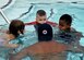 Bobby Broome, Joint Base Andrews pool manager and aquatics director, teaches kids how to submerge their faces during a water safety camp at Joint Base Andrews, Md., Aug. 21, 2018. Camp participants learned the basics of swimming as well as water safety and life-saving techniques. (U.S. Air Force photo by Senior Airman Abby L. Richardson)