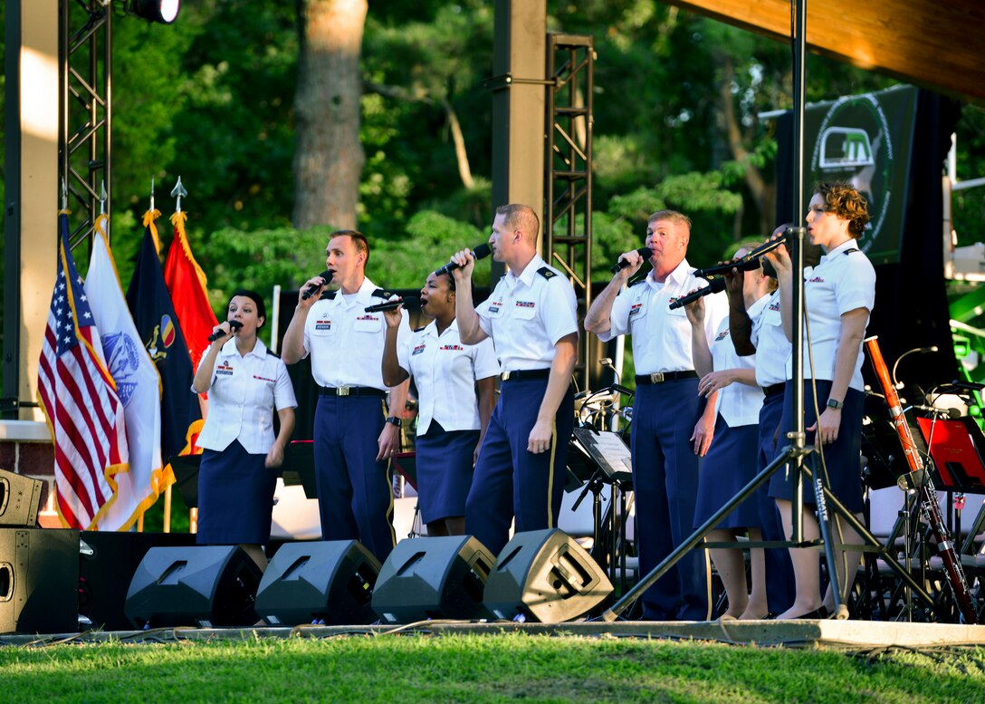 The U.S. Army Voices perform during the U.S. Army Training and Doctrine Command Band’s Music Under the Stars 86th season finale concert at Joint Base Langley-Eustis, Virginia, Aug. 23, 2018.