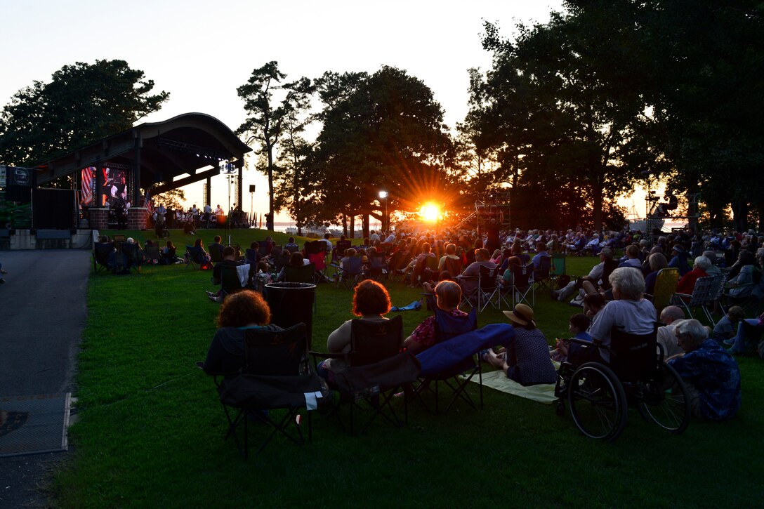 Patrons listen to the U.S. Army Training and Doctrine Command Band perform during the Music Under the Stars 86th season finale concert at Joint Base Langley-Eustis, Virginia, Aug. 23, 2018.