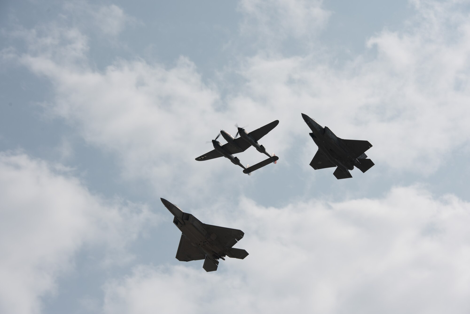 An F-22 Raptor, a P-38 Lightning and an F-35 Lightning II perform a heritage flight during the 2018 Defenders of Freedom Air & Space Show Aug. 12, at Offutt Air Force Base, Nebraska.