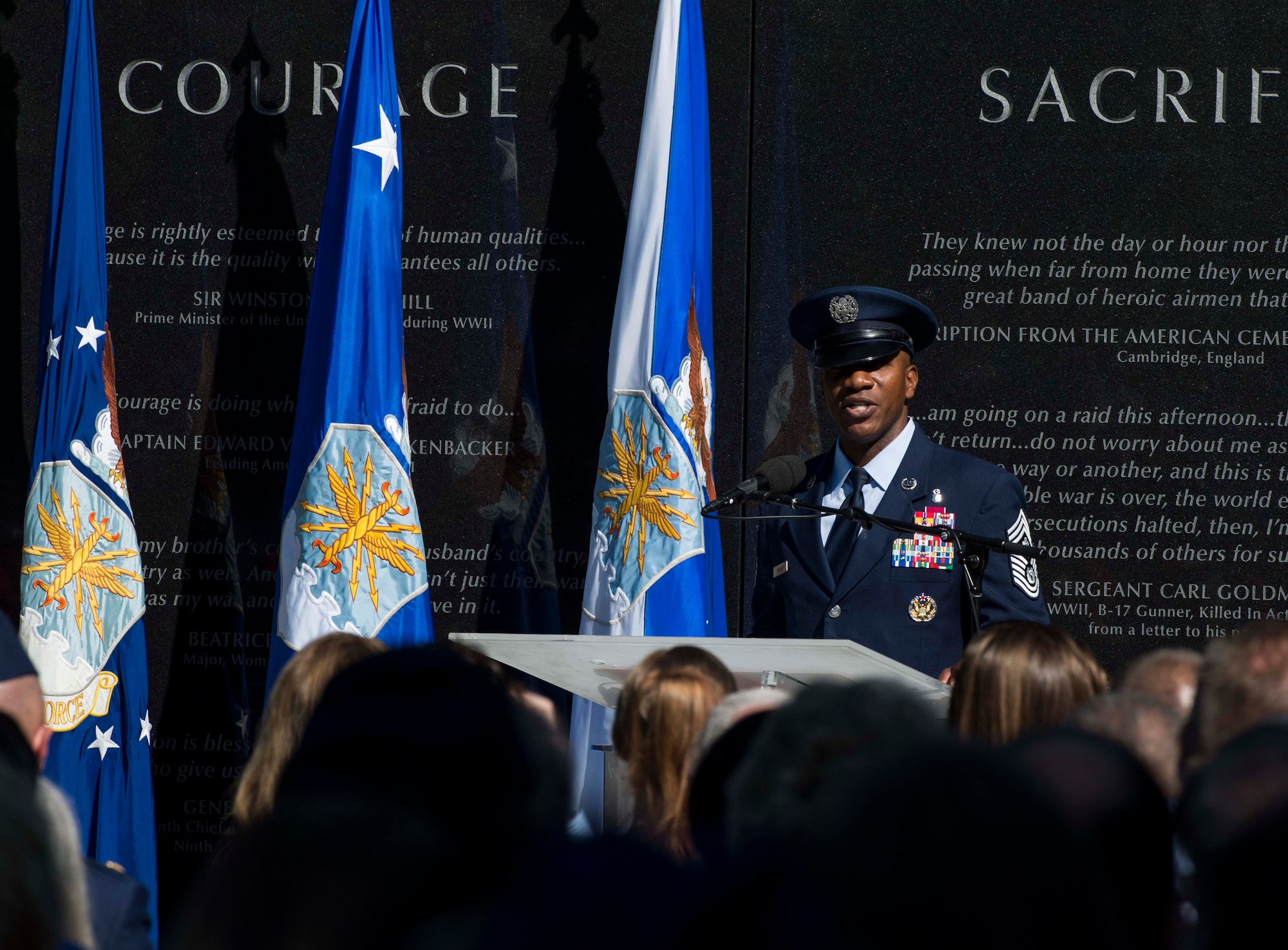 Chief Master Sgt. of the Air Force Kaleth O. Wright speaks during Master Sgt. John Chapman’s name unveiling ceremony at the Air Force Memorial in Arlington, Va., Aug. 24, 2018. Chapman was posthumously awarded the Medal of Honor for actions on Takur Ghar Mountain in Afghanistan March 4, 2002. An elite special operations team was ambushed by the enemy and came under heavy fire from multiple directions. Chapman immediately charged an enemy bunker through thigh-deep snow and killed all enemy occupants. Courageously moving from cover to assault a second machine gun bunker, he was injured by enemy fire. Despite severe wounds, he fought relentlessly, sustaining a violent engagement with multiple enemy personnel before making the ultimate sacrifice. With his last actions he saved the lives of his teammates. (U.S. Air Force photo by Tech. Sgt. DeAndre Curtiss)