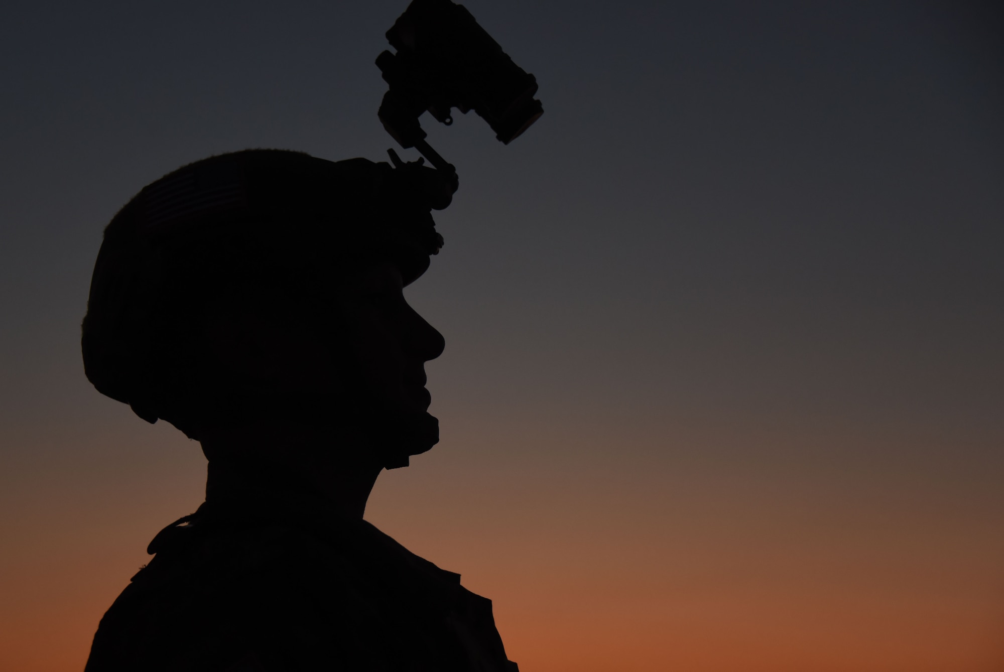 Capt. Eric Danko, with the 321st Contingency Response Squadron, prepares for a night air drop and C-130 Hercules landing during training at Camp Branch Landing Zone in Logan County, W.Va., Aug. 22, 2018. The 621st CRG spent four days training with and working alongside the 130th Air National Guard at Camp Branch practicing semi-prepared runway operations. (U.S. Air Force photo by Tech. Sgt. Jamie Powell)