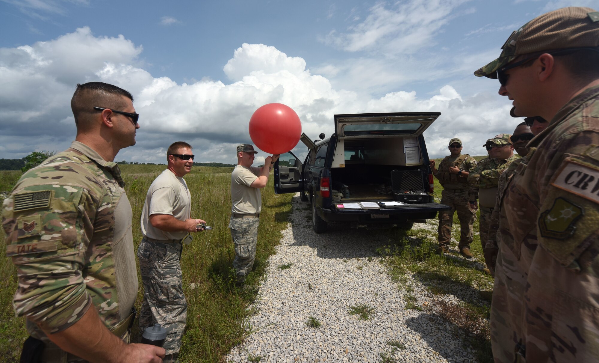 Air National Guard Airmen train 621st Contingency Response Airmen on weather balloons at Camp Branch in Logan County, W.Va., Aug. 21, 2018. The 621st CRG spent four days training with and working alongside the 130th ANG at Camp Branch practicing semi-prepared runway operations. (U.S. Air Force photo by Tech. Sgt. Jamie Powell)