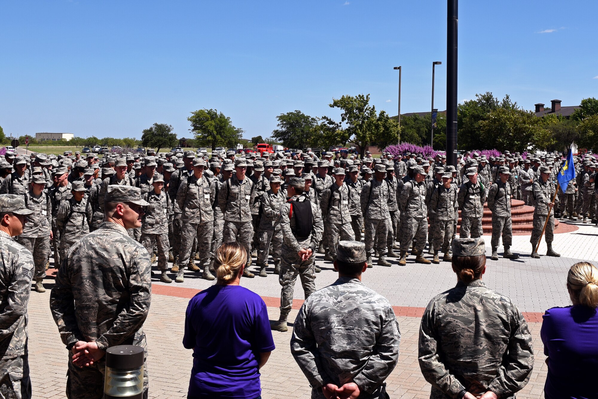Goodfellow service members gather for a moment of silence and a group reciting of the Airman’s Creed in honor of U.S. Air Force Master Sgt. John Chapman at the Norma Brown building on Goodfellow Air Force Base, Texas, Aug. 24, 2018. Chief Master Sgt. Jason Funkhauser, 315th Training Squadron chief enlisted manager, spoke on the events that lead to Chapman receiving the Medal of Honor. (U.S. Air Force photo by Airman 1st Class Zachary Chapman/Released)