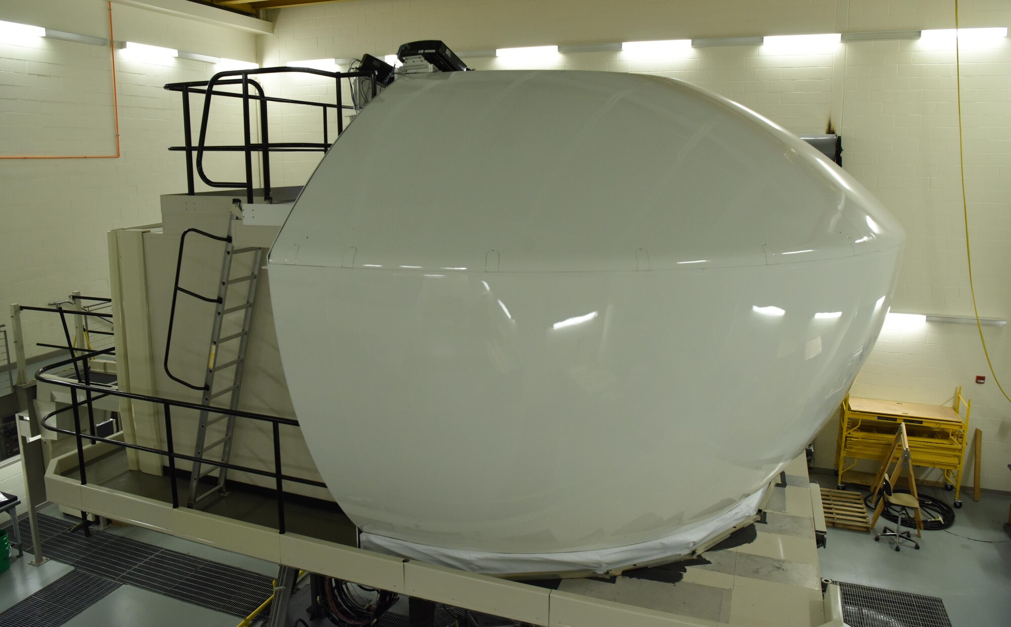 A weapon systems trainer is being prepared to simulate a mission for aircrew members at Ellsworth Air Force Base, S.D., Aug. 21, 2018. A WST saves the Air Force approximately $25,000 per hour, which allows aircrew members to get more training and use less resources. (U.S. Air Force photo by Airman 1st Class Thomas Karol)