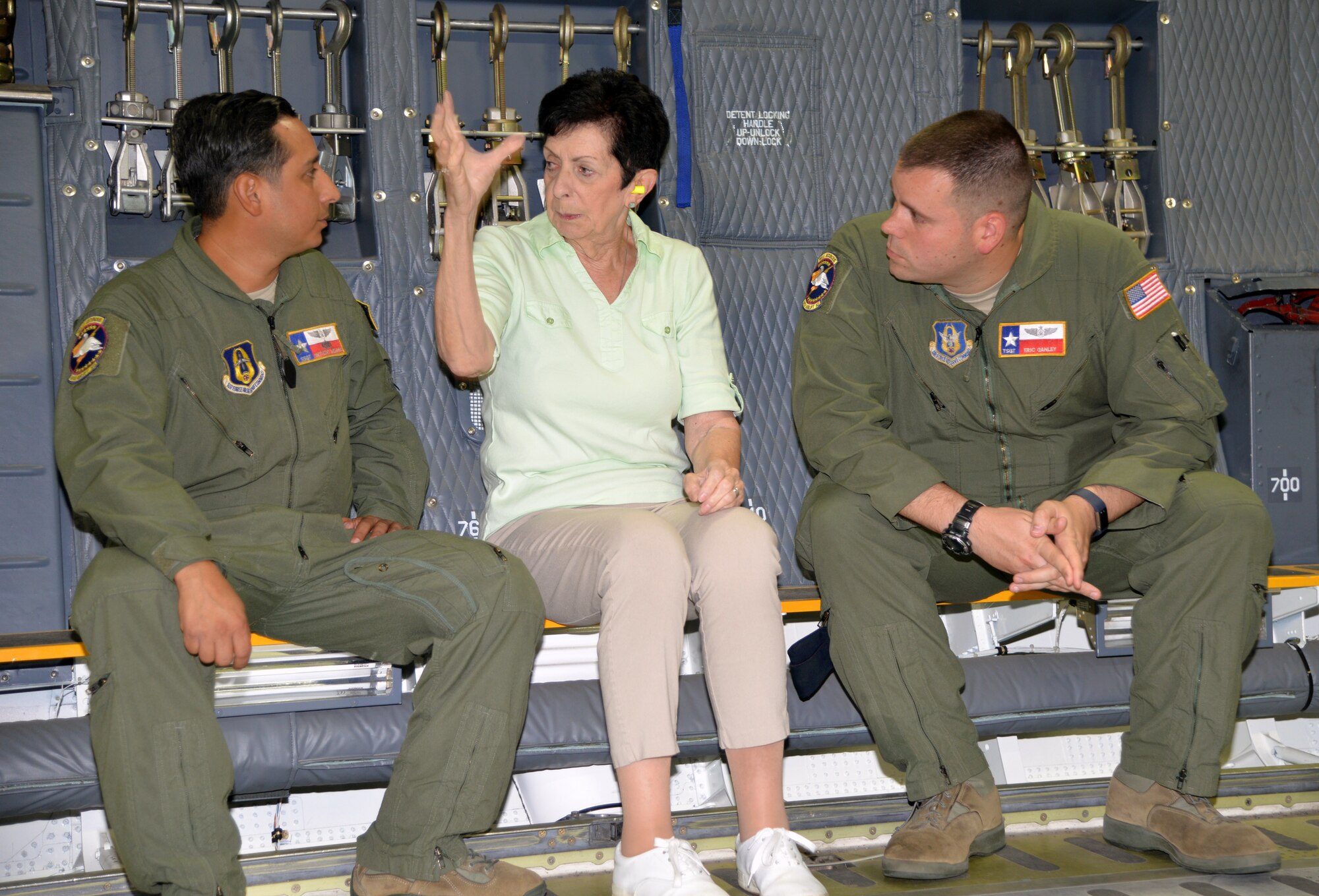 Retired U.S. Air Force Col. Regina Aune describes her experiences to Staff Sgt. Anthony B. Molina, 68th Airlift Squadron flight engineer (left), and Tech. Sgt. Eric K. Ganley, 68th Airlift Squadron flight engineer (right), while on a tour of a C-5M Super Galaxy Aug. 20, 2018 at Joint Base San Antonio-Lackland, Texas. (U.S. Air Force photo by Master Sgt. Kristian Carter)