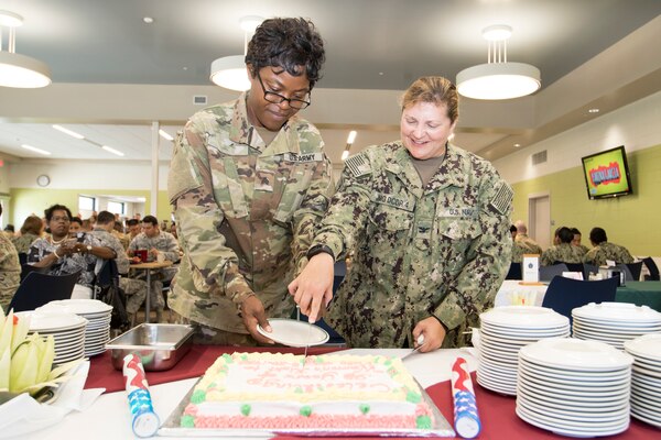 Joint Task Force Guantanamo recognized the 98th anniversary of Women’s Equality Day during a cake cutting ceremony on August 24.  JTF GTMO Commander, Navy Rear Adm. John C. Ring, along with member of the command staff and JTF Troopers, attended the ceremony.