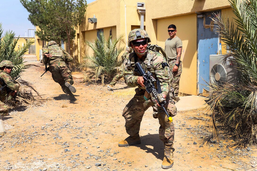 Soldiers react to a simulated attack from the opposing force.