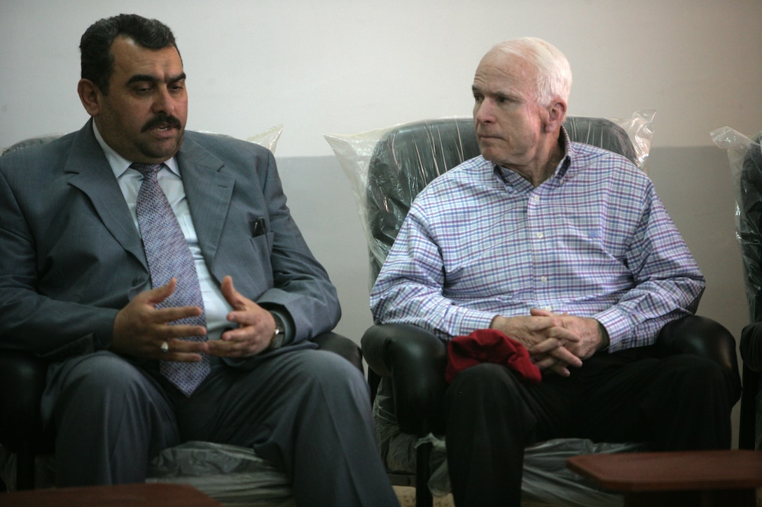 Arizona Sen. John S. McCain meets with Mamoun Sami Rasheed Al Awani, governor of Al Anbar in Haditha, Iraq, March 16, 2008. McCain asked questions about the Anbar Awakening as well as the economy in Haditha during his discussions. Courtesy photo