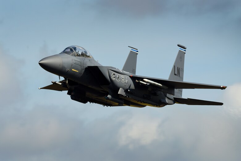 An F-15E Strike Eagle assigned to the 492nd Fighter Squadron flies over Royal Air Force Lakenheath, England, Aug. 17. The Madhatters leveraged their skill and knowledge with RAF aviators during Typhoon Warrior, the Royal Air Force’s premier air combat training exercise during the month of August. (U.S. Air Force photo/ Tech. Sgt. Matthew Plew)