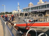 Members of Joint Task Force Civil Support board a U.S. Coast Guard vessel to navigate down the Detroit River while attending the 2018 DoD Support of Civil Authorities (DSCA)/Chemical, Biological, Radiological and Nuclear (CBRN) Dense Urban Terrain Training Tactical Exercise Without Troops exercise held August 21-23 in Detroit Michigan. The task force members were among the 150 participants from more than 50 organizations of the interagency, to include local, state, federal and international partners. They gathered to increase their readiness for the CBRN mission with a focus on operating in a dense urban environment. Detroit is an inland seaport and handles traffic from all over the world by way of various connecting waterways and so afforded the training attendees with the opportunity to consider the challenges of responding to a DSCA event by water. The training was held by the 46th Military Police Command, Michigan Army National Guard, Command and Control CBRN Response Element – Bravo and also included training within the city landscape. (Official DoD photo by Air Force Lt. Col. Karen Roganov/released)