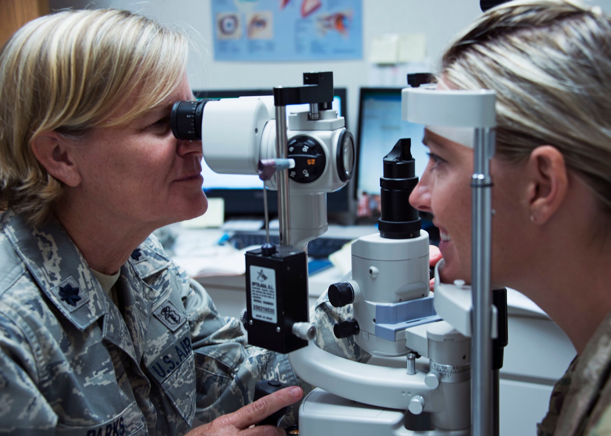 Lt. Col. Kelli Parks, an optometrist with the 919th Special Operations Medical Squadron, performs an eye exam on a fellow Air Force reservist Aug. 5, 2018 at Hurlburt Field, Fla.