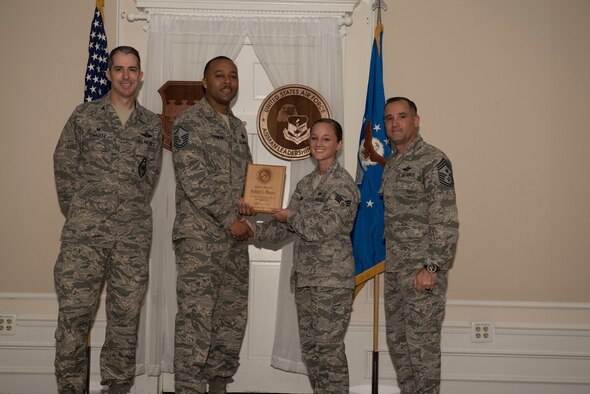 U.S. Air Force Senior Airman Sydney Moore, Airman Leadership School (ALS) student assigned to the 20th Fighter Wing, receives the Senior Master Sgt. David B. Reid ALS Commandant’s Award during the ALS Class 18-6 graduation ceremony at Shaw Air Force Base, S.C., Aug. 23, 2018.