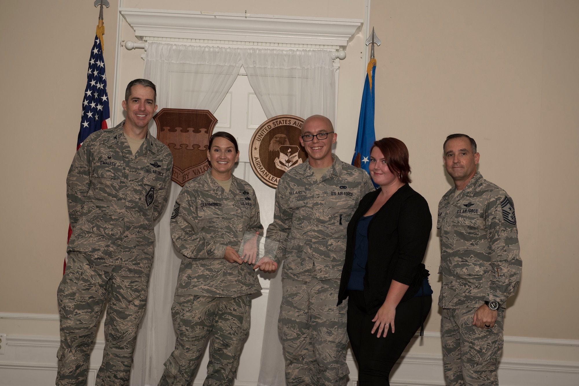 U.S. Air Force Staff Sgt. Benjamin Pollard, Airman Leadership School (ALS) student assigned to the 20th Aircraft Maintenance Squadron, receives a distinguished graduate award for Class 18-6 of the Senior Master Sgt. David B. Reid ALS, at Shaw Air Force Base, S.C., Aug. 23, 2018.