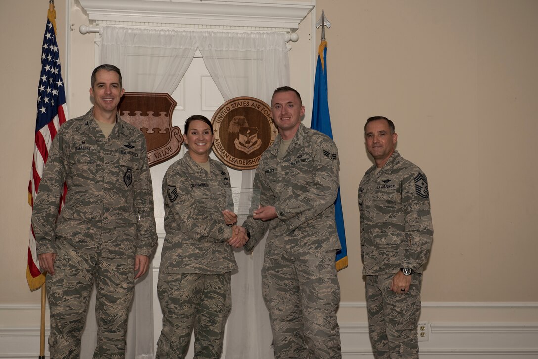 U.S. Air Force Senior Airman Joshua Spurlock, Airman Leadership School (ALS) student assigned to the 28th Operational Weather Squadron, receives a distinguished graduate award for Class 18-6 of the Senior Master Sgt. David B. Reid ALS, at Shaw Air Force Base, S.C., Aug. 23, 2018.
