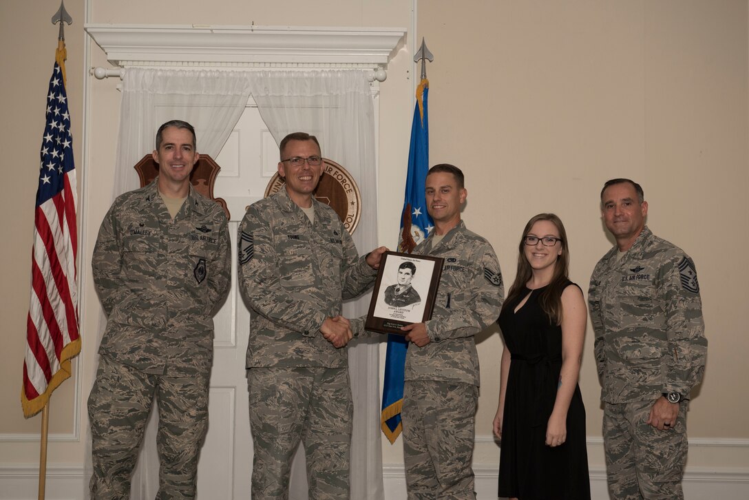 U.S. Air Force Staff Sgt. Kyle Horton, Airman Leadership School (ALS) student assigned to the 20th Aircraft Maintenance Squadron, receives the John L. Levitow Award for Class 18-6 of the Senior Master Sgt. David B. Reid ALS at Shaw Air Force Base, S.C., Aug. 23, 2018.