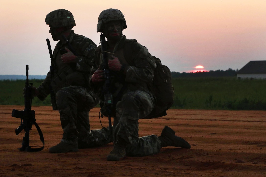Soldiers provide security after conducting a static-line airborne operation.