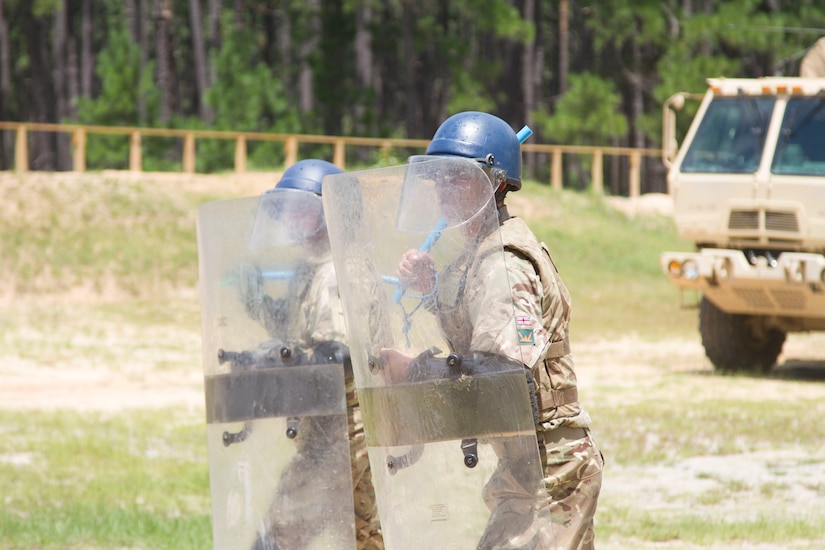 Two Soldiers from 1 Rifles, British Army, stand ready to repel a group of rioters advancing on their position as they take part in riot control training during Exercise STEPPE EAGLE 18.
The United States, United Kingdom and Central Asian States partners are committed to promoting security, stability and our mutual interests in the region.