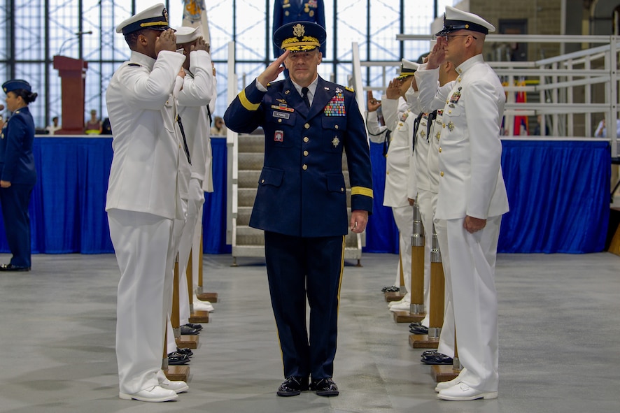 U.S. Army Gen. Stephen R. Lyons salutes a detail of sailors after taking command of U.S. Transportation Command during a ceremony held at Scott Air Force Base, Illinois, Aug. 24, 2018.