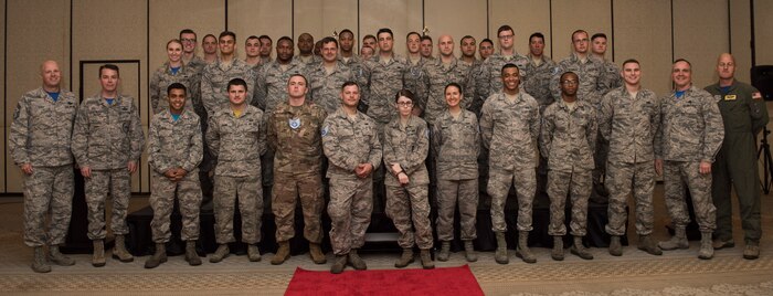 Joint Base Charleston's newest staff sergeant selects from the 437th Airlift Wing stand on stage to be recognized during the Staff Sergeant Release Party Aug. 24, 2018, at the Charleston Club.