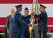U.S. Air Force Gen. Darren W. McDew passes the U.S. Transportation Command guidon to U.S. Army Gen. Stephen R. Lyons during a change of command ceremony held Aug. 24, 2018, at Scott Air Force Base, Illinois.
