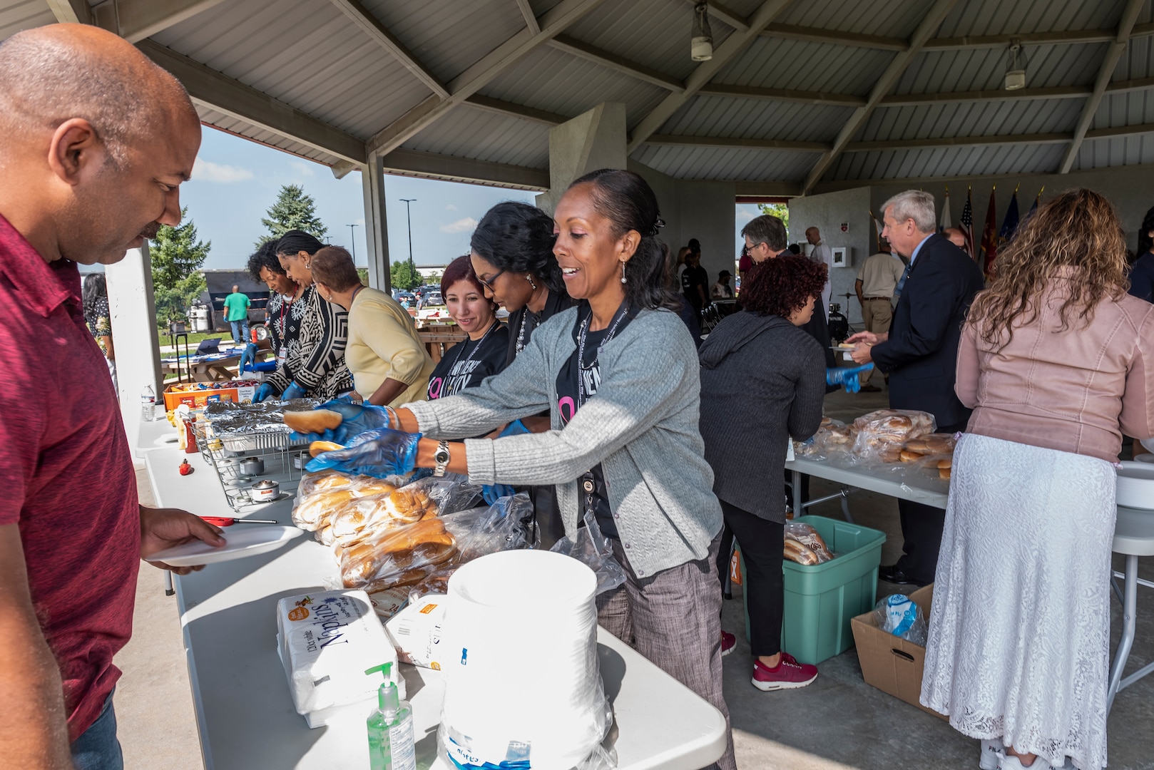 Associate enjoy free lunch at Women's Equality Day program