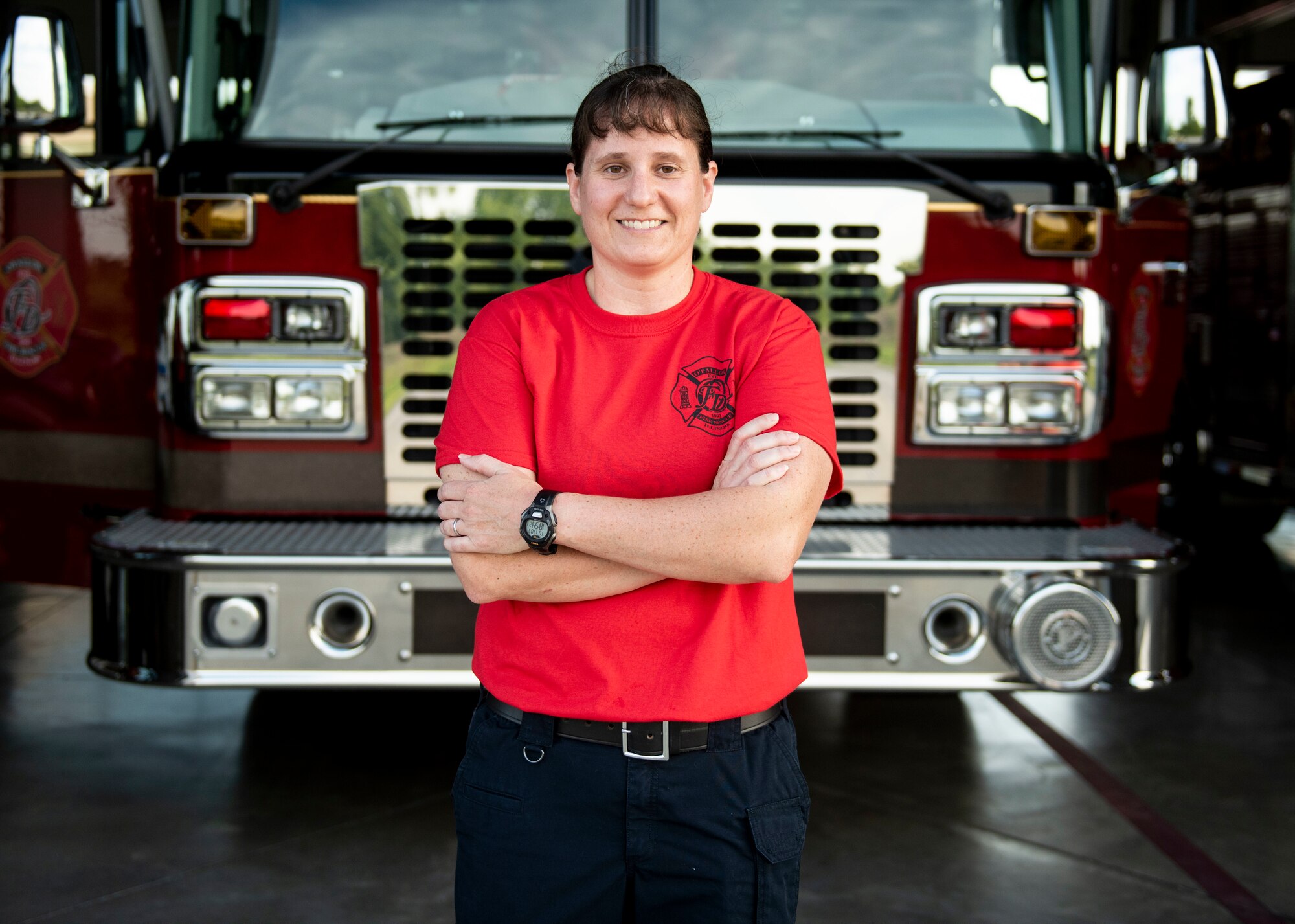 U.S. Army Maj. Nikki Blystone, U.S. Transportation Command logistics officer, stands in front of a fire engine, July 7, 2017, at the O’Fallon Fire Department in O’Fallon, Illinois. Blystone said some of the best moments come from educating young girls about being a firefighter: “I see some of the little girls that come up when we do a truck display and ask them, “Are you going to be a firefighter?’ and the look in their eyes is ‘Oh, I can do that?’ I hope one day that’s not a question.”