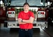 U.S. Army Maj. Nikki Blystone, U.S. Transportation Command logistics officer, stands in front of a fire engine, July 7, 2017, at the O’Fallon Fire Department in O’Fallon, Illinois. Blystone said some of the best moments come from educating young girls about being a firefighter: “I see some of the little girls that come up when we do a truck display and ask them, “Are you going to be a firefighter?’ and the look in their eyes is ‘Oh, I can do that?’ I hope one day that’s not a question.”