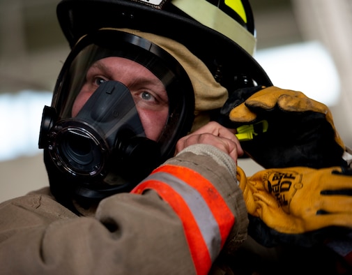 U.S. Air Force Tech Sgt. Thomas Dunlap, 375th Communications Squadron NCO in charge of radio frequency transmissions, suits up in bunker gear, July 7, 2017, at the O’Fallon Fire Department in O’Fallon, Illinois. “Each call has its own personality,” said Dunlap. “What you do, what you see is different, and so each one you learn from and see what you can improve on for the next call.”