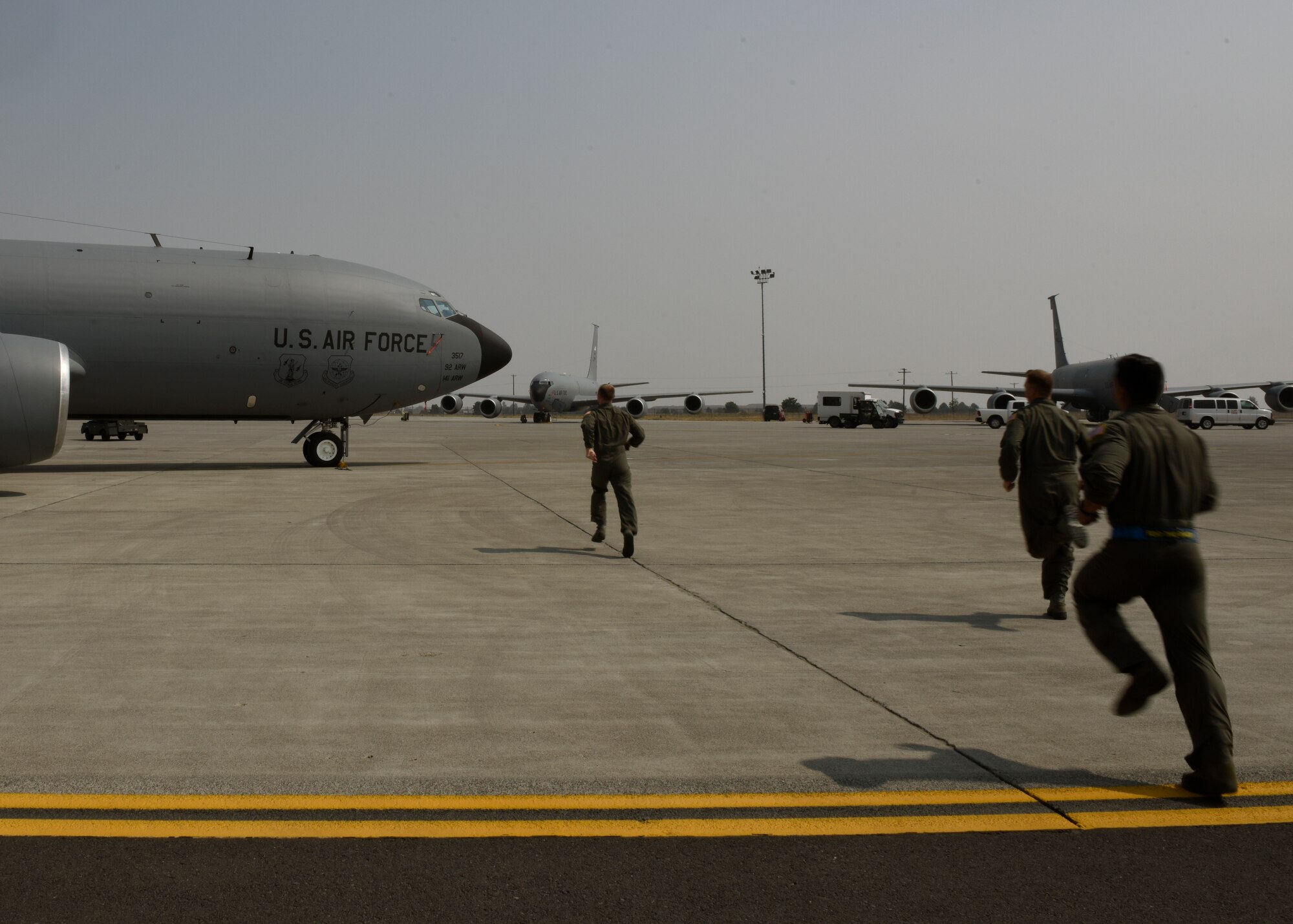 Fairchild Airmen rush to an awaiting KC-135 Stratotanker during exercise Titan Fury at Fairchild Air Force Base, Washington, Aug. 21, 2018. Titan Fury is a readiness exercise used to validate and enhance Fairchild Airmen’s mobility to provide Rapid Global Mobility as required by U.S. Strategic Command and U.S. Transportation Command. (U.S. Air Force photo/ Airman 1st Class Jesenia Landaverde)